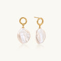 18K gold vermeil twisted circle studs with organic white baroque pearl drops on cream background