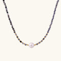 Dainty necklace with faceted purple iolite beads, gold vermeil accents, and central pink-white freshwater pearl.
