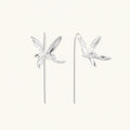 Delicate sterling silver dragonfly earrings with textured wings and curved threader hooks on white background
