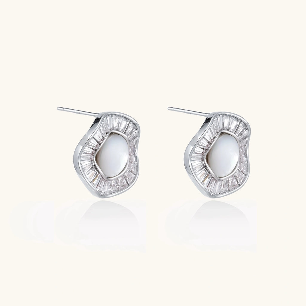 Round white gold-plated stud earrings with mother of pearl center and baguette crystal halo surround, 16.2mm diameter.