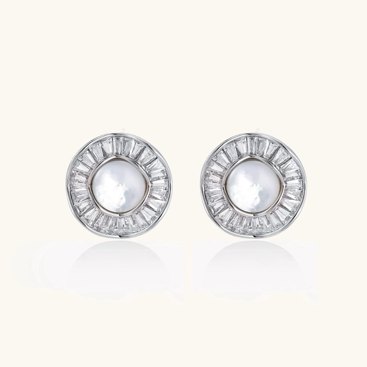 Round white gold-plated stud earrings with mother of pearl center and baguette crystal halo surround, 16.2mm diameter.