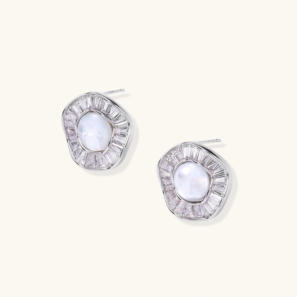 Round white gold-plated stud earrings with mother of pearl center and baguette crystal halo surround, 16.2mm diameter.