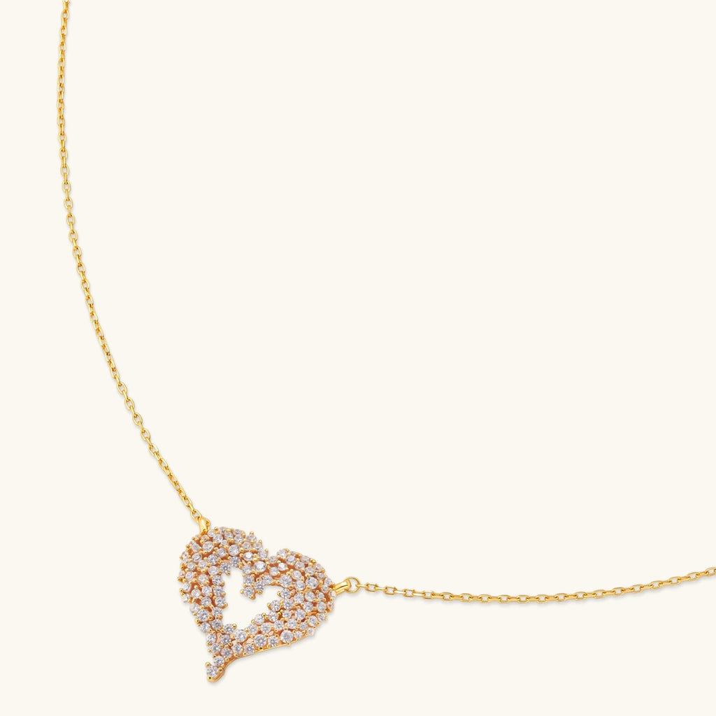 18K gold-plated 925 silver open heart pendant necklace with scattered cubic zirconia stones on a fine cable chain.