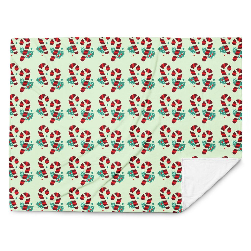 Green Christmas throw blanket with candy cane design, front view, image 2