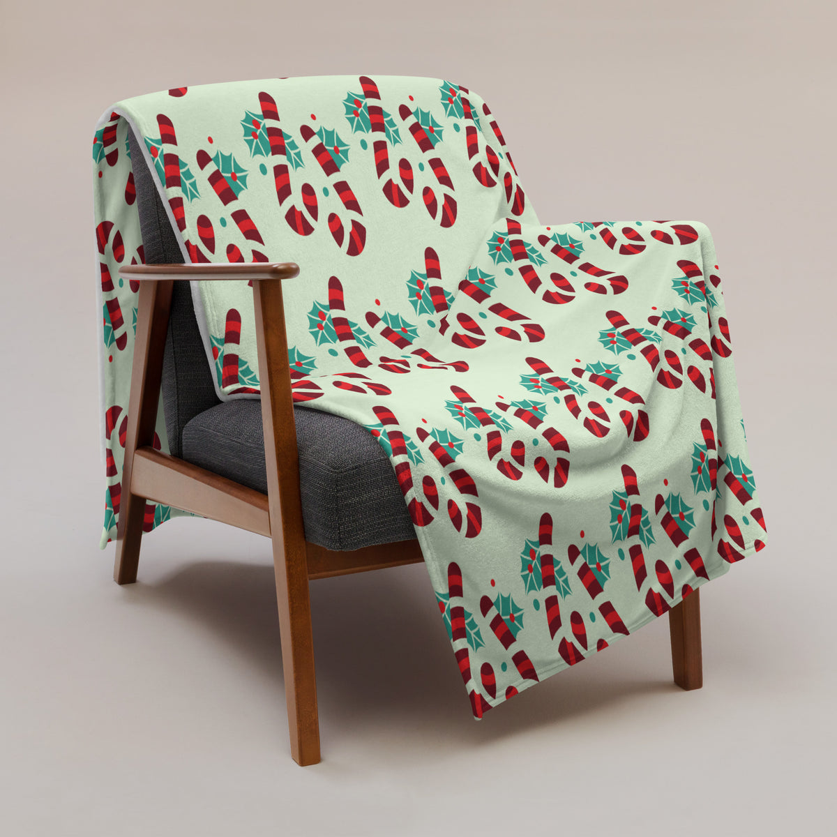 Green Christmas throw blanket with candy cane design, lifestyle view, image 1
